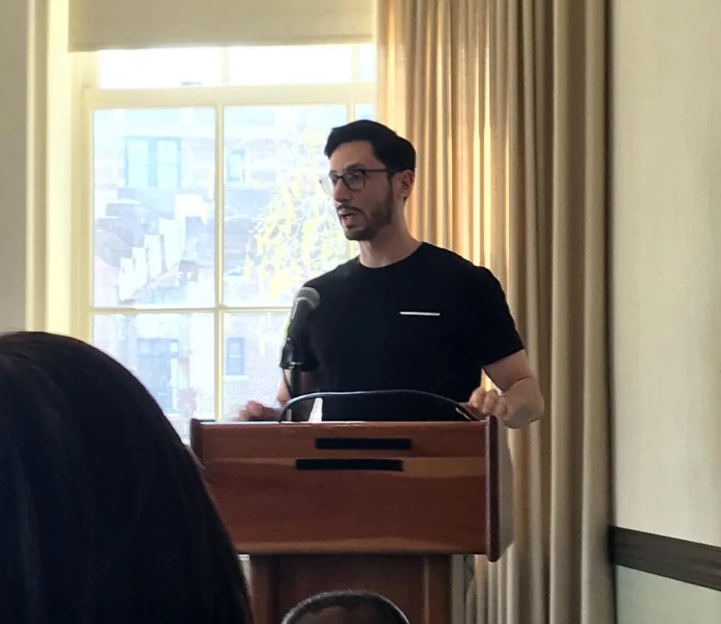 Christopher Medina-Kirchner moderating a panel. 