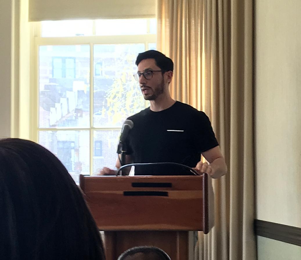 Christopher Medina-Kirchner moderating a panel. 