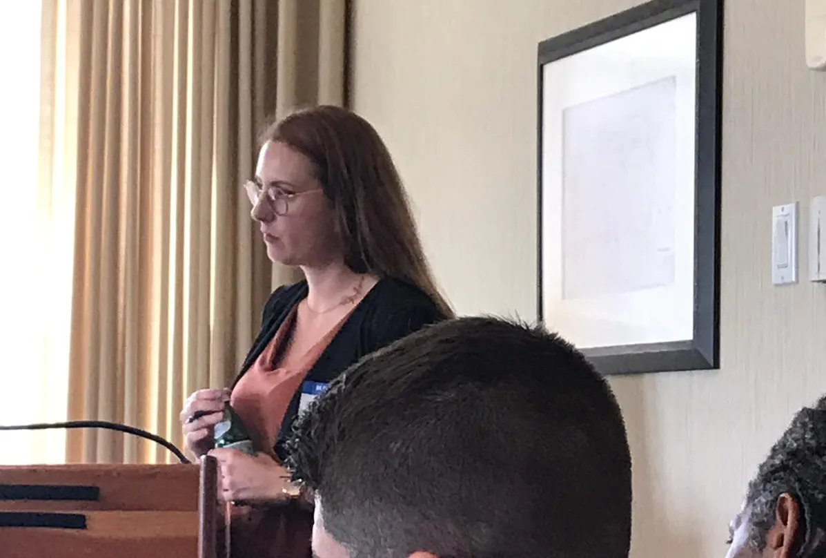 Kate O'Malley moderating a panel.