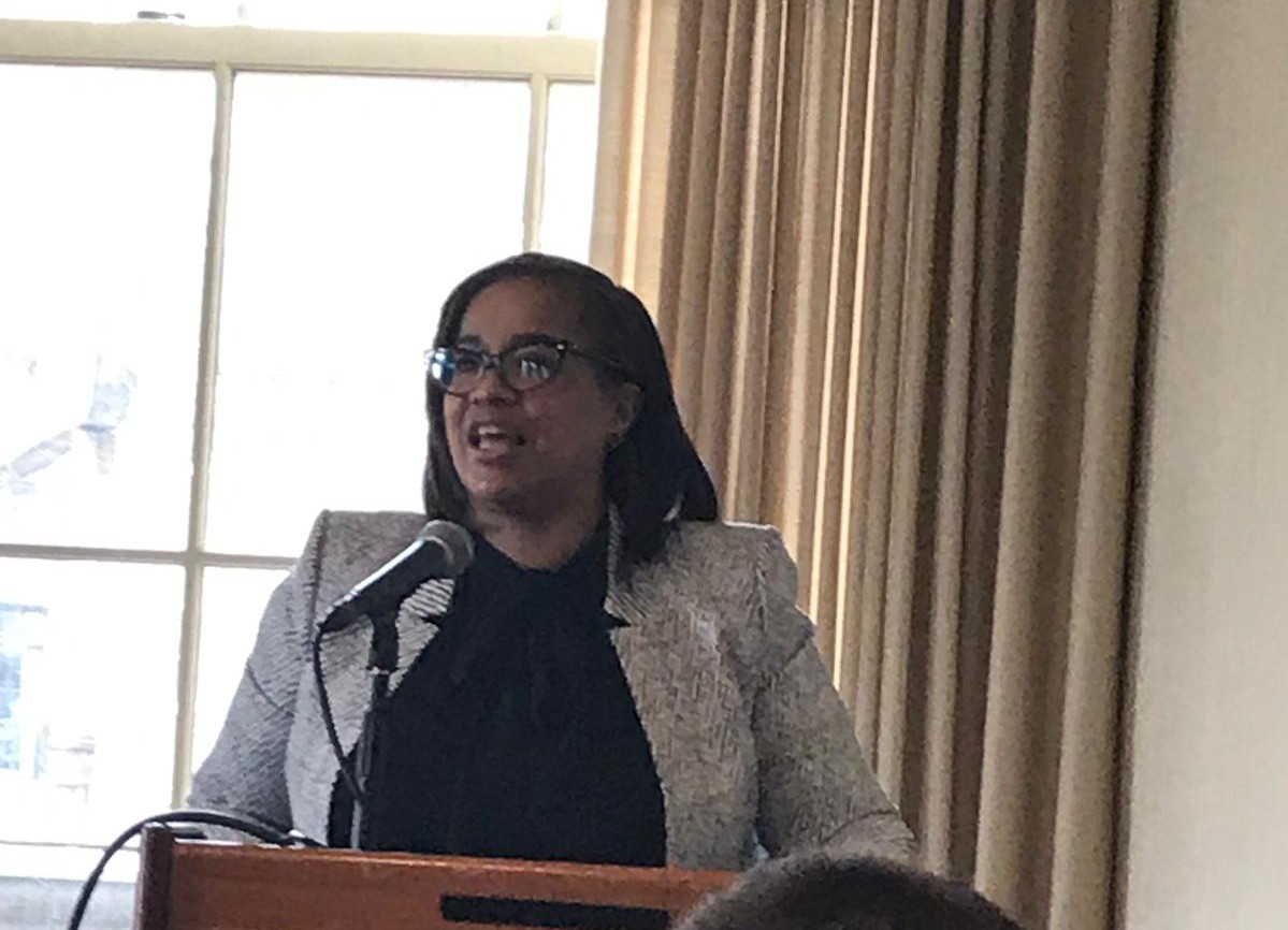 Tiesha Gregory moderating a panel.